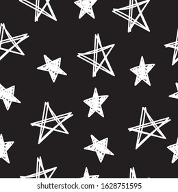 Hand drawn seamless star pattern on dark background.