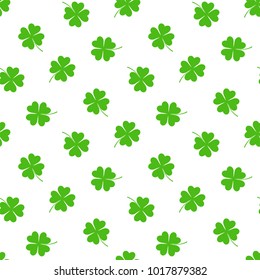 Hand drawn seamless vector pattern with four leaf clovers on a white background. Design concept for Saint Patrick's day celebration, kids textile print, wallpaper, wrapping paper.