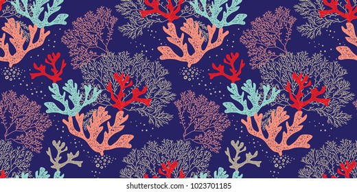 Hand drawn seamless vector pattern. Trendy pattern with corals and algae on a blue background for printing, fabric, textile, manufacturing, wallpapers. Sea bottom.
