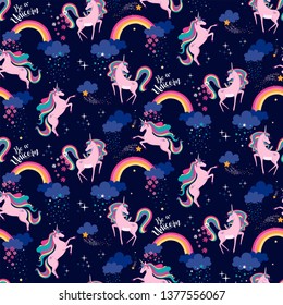 Hand drawn seamless vector pattern with cute unicorns and stars. Repetitive wallpaper on dark blue background. Perfect for fabric, wallpaper, wrapping paper or nursery decor.