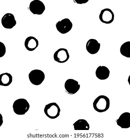 Hand drawn seamless vector pattern with abstract black circles. Trendy vector background for prints, textile and wallpaper. Modern backdrop in grunge style in black and white