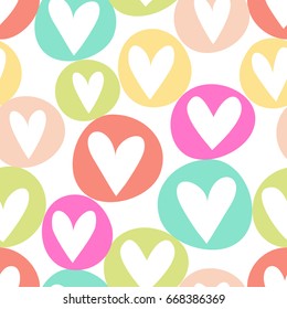 Hand drawn seamless vector retro heart pattern.  Hand illustrated colorful quirky heart in circle background.