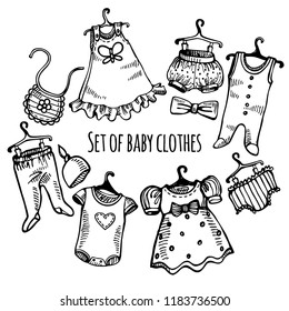 Hand drawn set of baby clothes on hangers: dress, pants, t-shirt, hat, bow, trousers, sliders, bib, romper, jumper. Vector isolated outline on white background. Sketch style