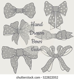Hand drawn set of beautiful tender bows with polka dots. Ideal for your own design. Isolated vector illustration