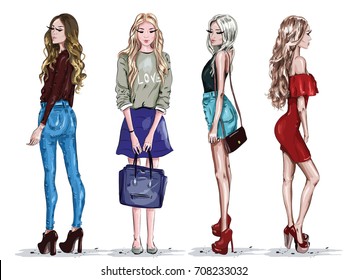 Hand drawn set with beautiful young women in fashion clothes. Stylish girls. Sketch. Vector illustration.