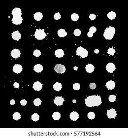 Hand drawn set blots, splashes and blobs.  Vector illustration. White blots on the black background.