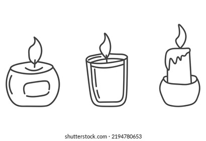 Hand drawn set of candles. Doodle candles. Burning aroma candles in glass jars doodle