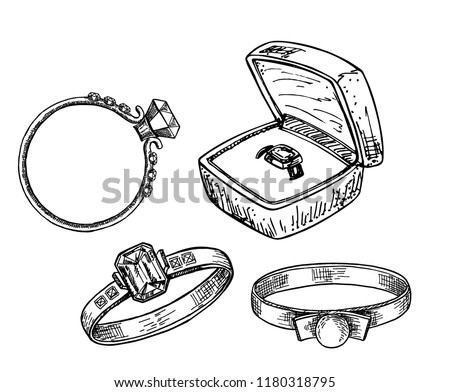 Hand drawn a set of different jewelry rings. Vector illustration of a sketch style. Ring in the gift box.