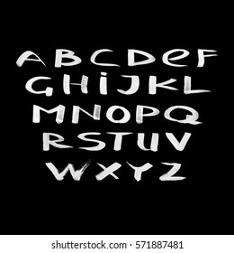Hand drawn set dry brush style Roman alphabet.  Vector illustration. White letters on the black background.