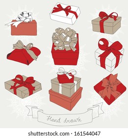 Hand drawn set of gift boxes with bows and ribbons. Vintage vector illustration.