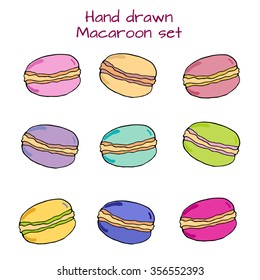 Hand drawn set with green, yellow, orange, red, blue, pink, blue macaroons. Colored sketch with french sweets. Decoration for desert menu. Vector stock illustration. 