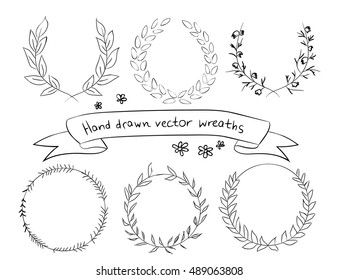 Hand drawn set laurel wreath - symbol of victory and achievement. Black silhouette on white background. Laurel wreath icon