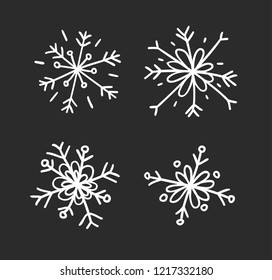 Hand drawn set of vintage snowflakes. White on black background. Abstract  doodle drawing snow. Vector retro art illustration