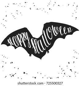 Hand drawn silhouette of flying vampire bat, with wide spread wings. Sketch vector illustration, isolated on grunge spot background with phrase "Happy Halloween".