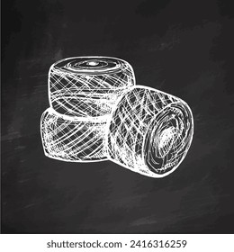 Hand drawn sketch of balls of threads on chalkboard background. Handmade, knitting equipment concept in vintage doodle style. Engraving style.	