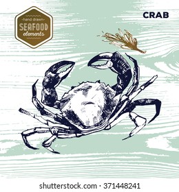 Hand drawn sketch seafood of crab and oregano on grunge wood texture background. Vector illustration. Vintage style. 