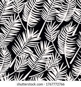 Hand drawn sketch style silhouette of palm leaves on dark background. Vector seamless pattern for textile, card, print.