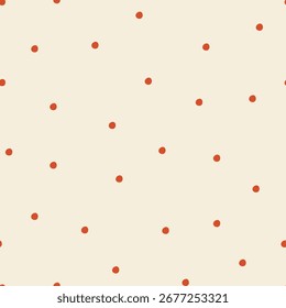 Hand drawn small red polka dotson light background.