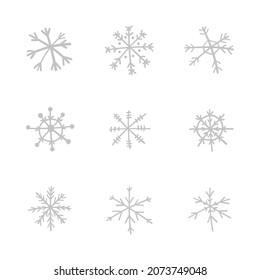 Colección de iconos del vector de copo de nieve dibujado a mano, símbolo de nieve de invierno