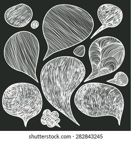 Hand drawn speech bubbles doodles in black chalkboard