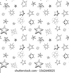 
Hand drawn stars doodle seamless pattern. Background with stars for decoration isolated on white background.