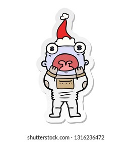 hand drawn sticker cartoon of a alien gasping in surprise wearing santa hat