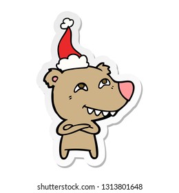 hand drawn sticker cartoon of a bear showing teeth wearing santa hat