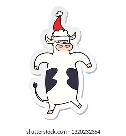 hand drawn sticker cartoon of a bull wearing santa hat