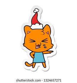 hand drawn sticker cartoon of a cat hissing wearing santa hat