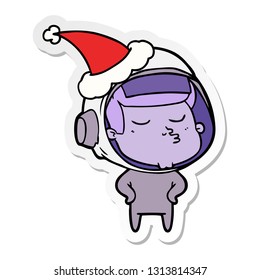 hand drawn sticker cartoon of a confident astronaut wearing santa hat