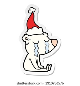 caricatura de un oso polar sentado llorando usando sombrero de santa