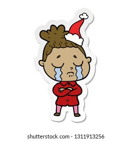 handgezeichneter Aufkleber, Cartoon einer weinenden Frau mit Santa-Hut