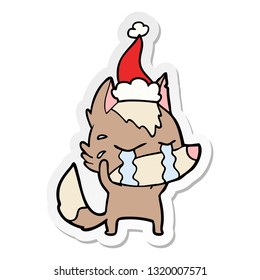 hand drawn sticker cartoon of a crying wolf wearing santa hat