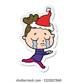 hand drawn sticker cartoon of a crying woman wearing santa hat