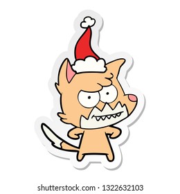 hand drawn sticker cartoon of a grinning fox wearing santa hat