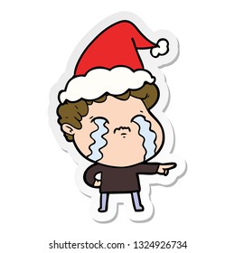 hand drawn sticker cartoon of a man crying wearing santa hat