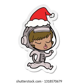 hand drawn sticker cartoon of a pretty astronaut girl running wearing santa hat