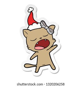 hand drawn sticker cartoon of a singing cat wearing santa hat