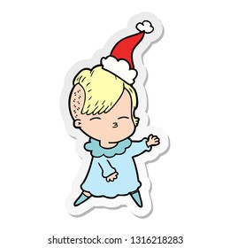 hand drawn sticker cartoon of a squinting girl wearing santa hat