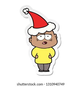 hand drawn sticker cartoon of a tired bald man wearing santa hat
