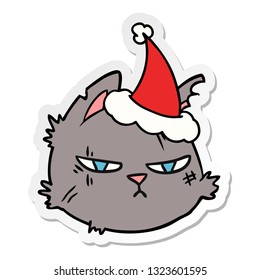 hand drawn sticker cartoon of a tough cat face wearing santa hat