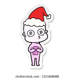 hand drawn sticker cartoon of a weird bald spaceman wearing santa hat