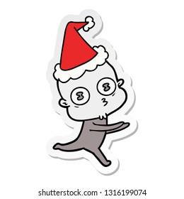 hand drawn sticker cartoon of a weird bald spaceman running wearing santa hat
