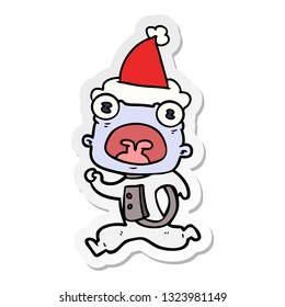hand drawn sticker cartoon of a weird alien running away wearing santa hat