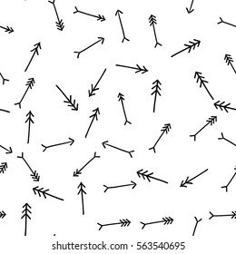 Hand drawn straight tribal arrows randomly placed on white background. Seamless pattern. Right, left, up and down abstract pointers with arrowheads wrapping texture. Vector eps8 illustration.