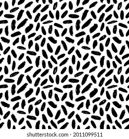 Hand drawn striped seamless pattern with short lines and dashes. Grunge brushstrokes on white background. Abstract background in Scandinavia modern style. Modern vector black and white pattern.