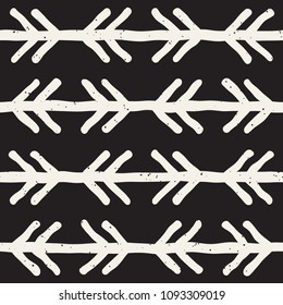 Hand drawn style ethnic seamless pattern. Abstract grungy geometric shapes background in black and white.