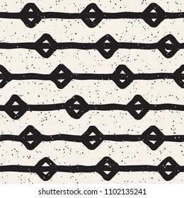 Hand drawn style ethnic seamless pattern. Abstract grungy geometric shapes background in black and white.