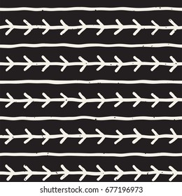 Hand drawn style ethnic seamless pattern. Abstract geometric tiling background in black and white. Vector vintage freehand doodle texture.