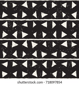 Hand drawn style ethnic seamless pattern. Abstract grungy geometric shapes background in black and white.